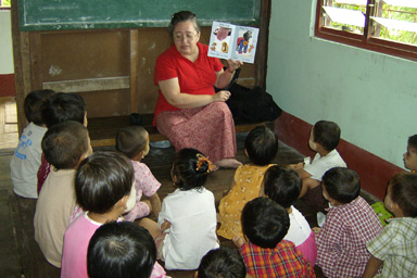 Bonnie teaching Burmese children