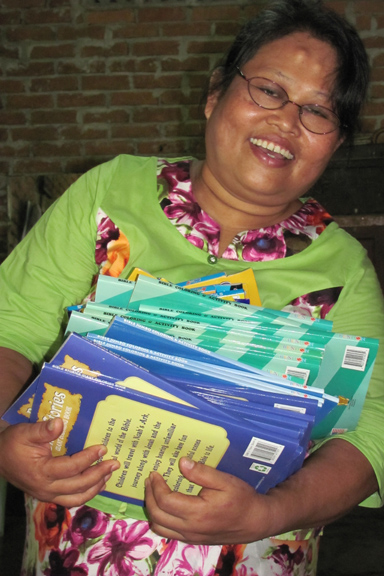 Julia Sein Resupplied with Bible Story Coloring Books and Colored Pencils